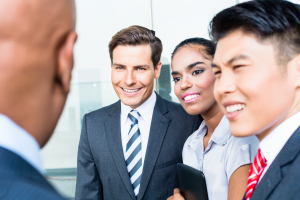 business people greeting each other and smiling