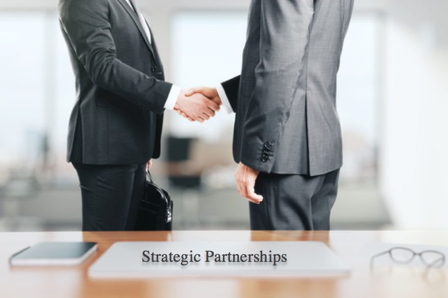 Two businessmen shaking hands, creating a strategic partnership