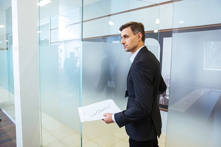 Confident businessman entering office